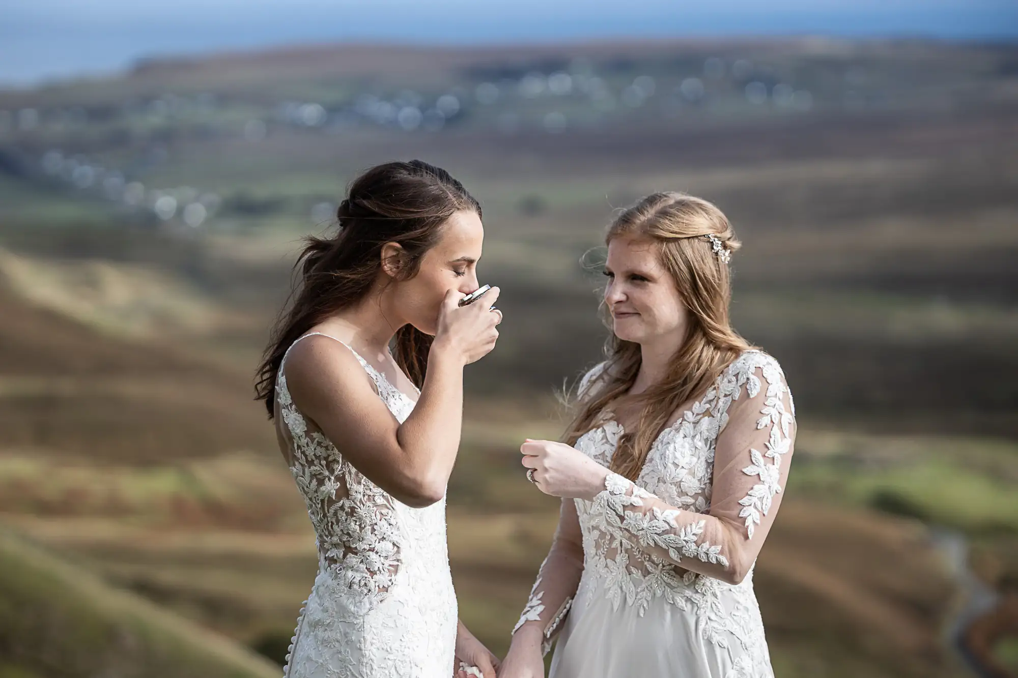 bride sips whisky from a quaich