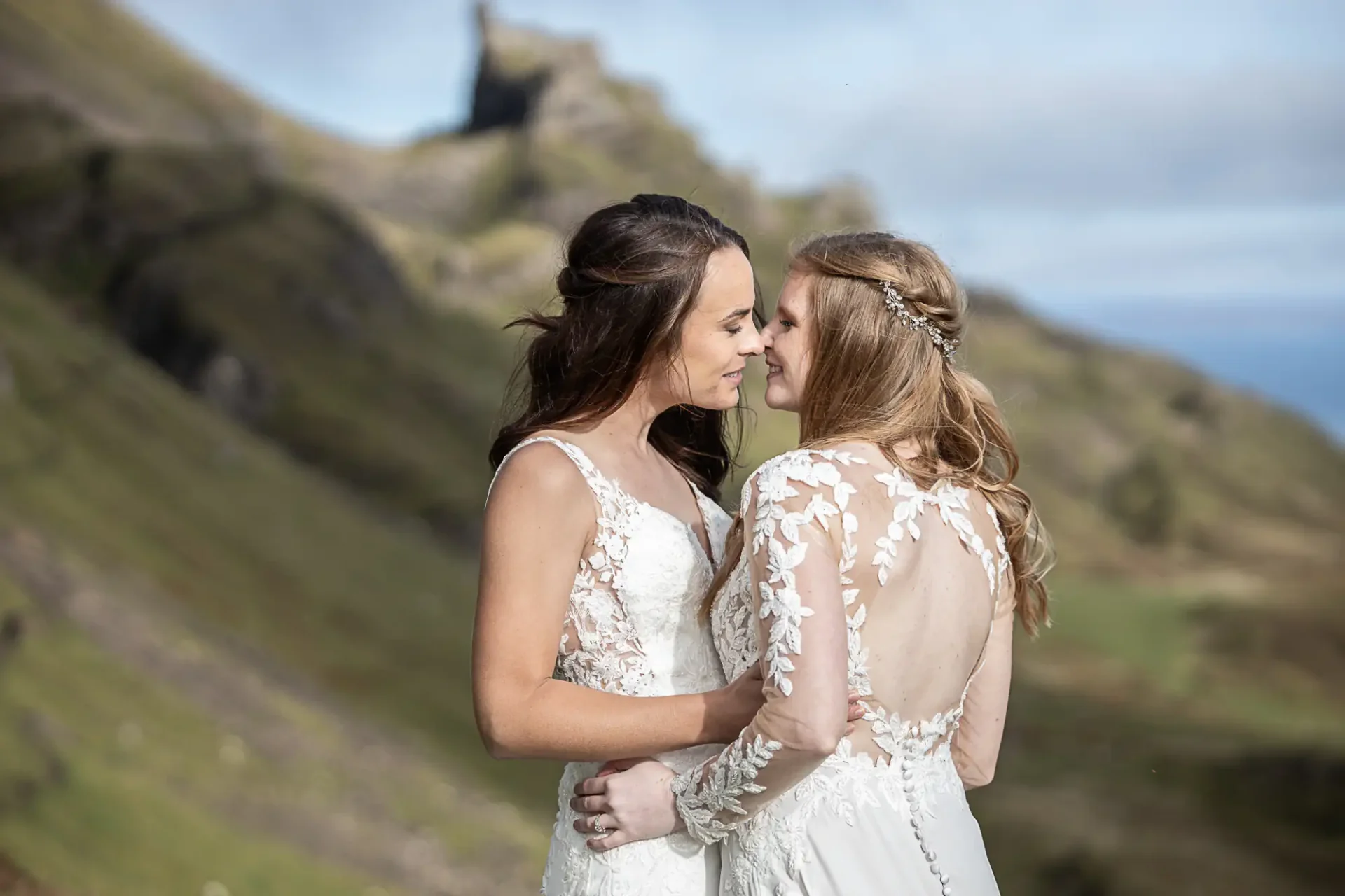 two brides embrace