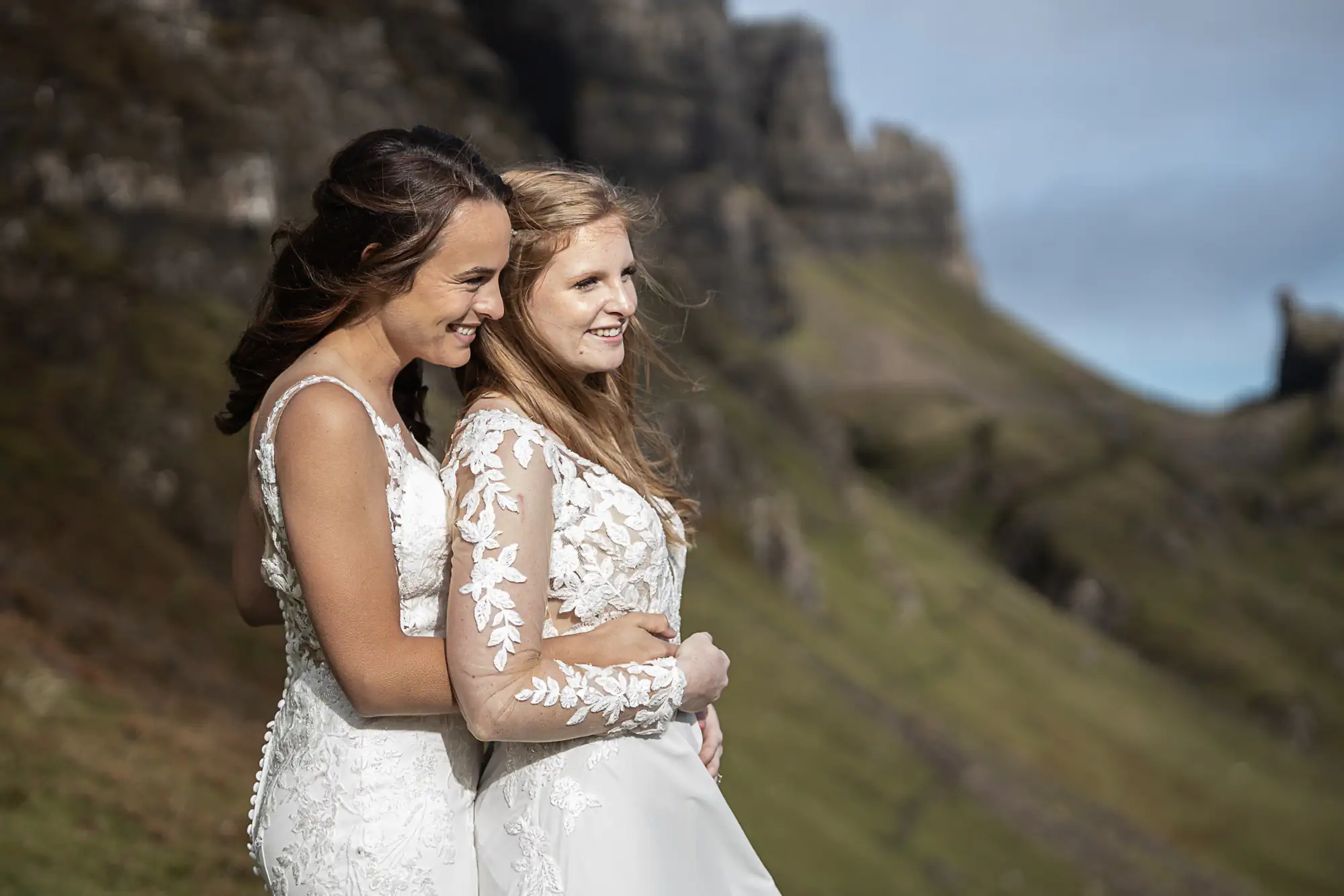 brides bask in the sun on the side of a mountain