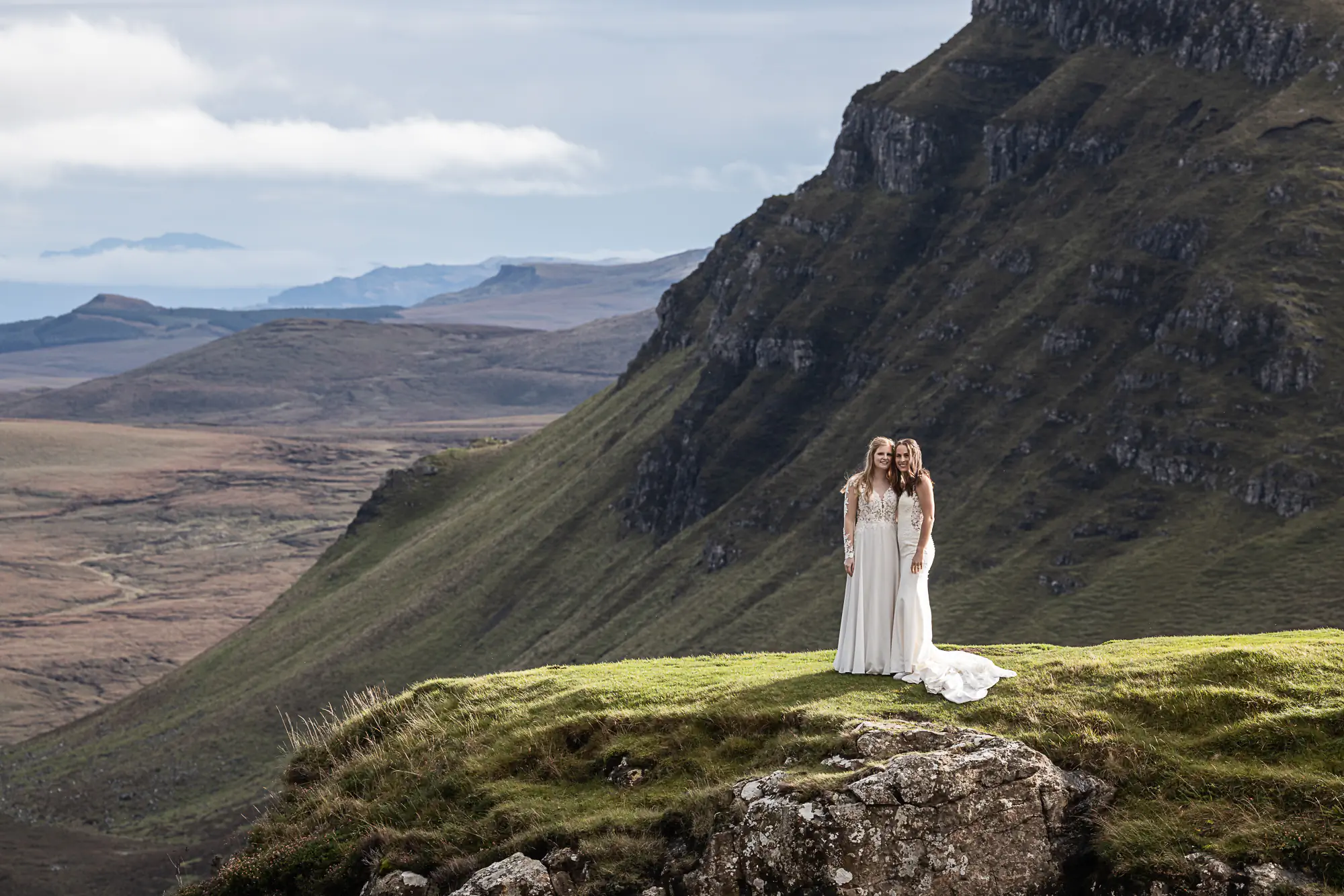 newlywed girls with a dramatic view