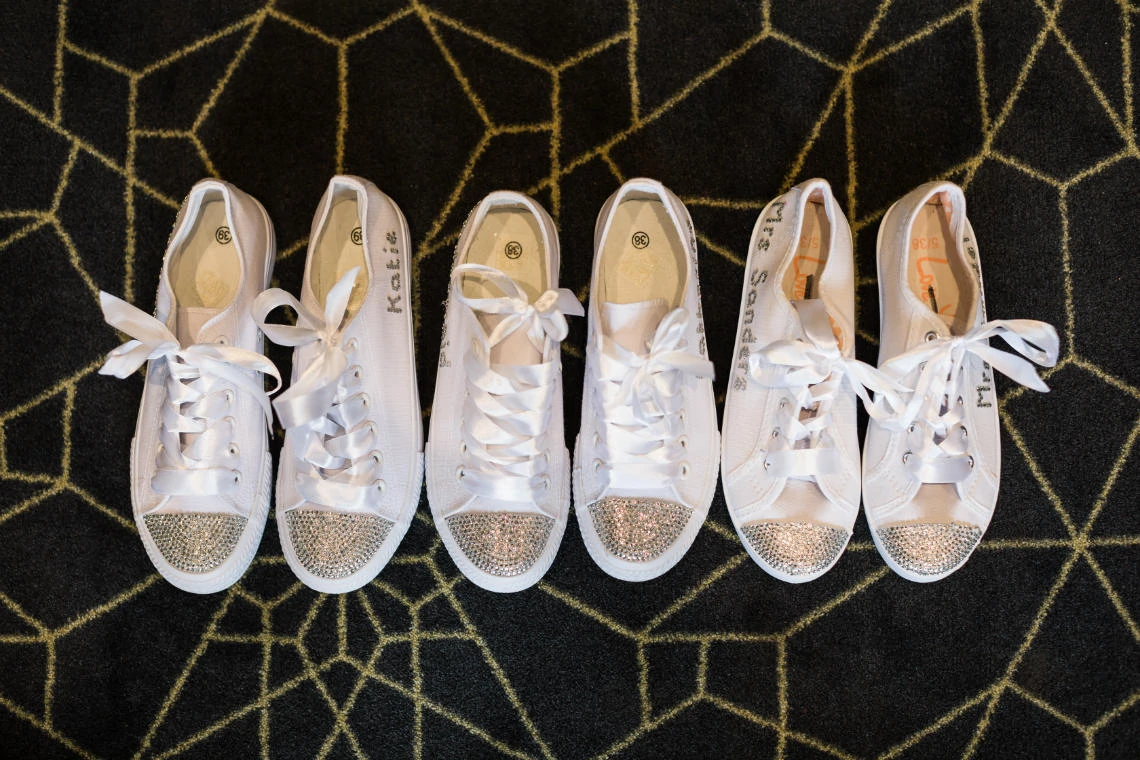white bride and bridesmaids pumps with white ribbon laces