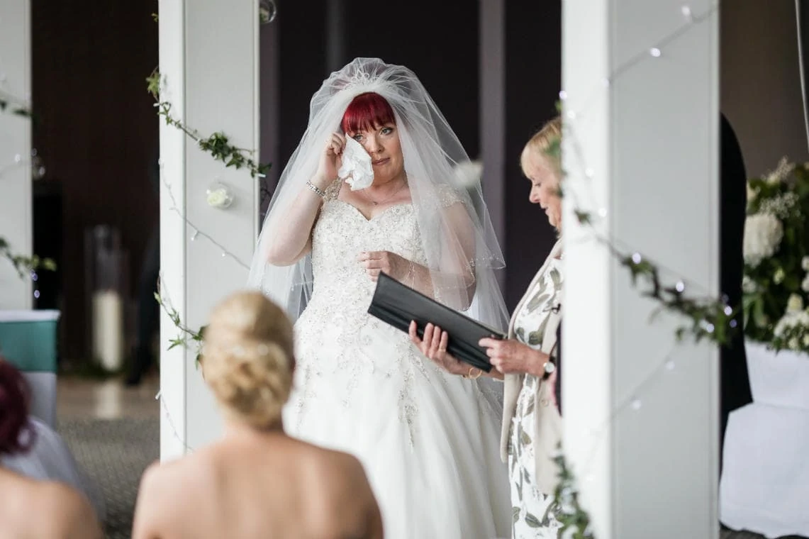 bride wipes away a tear during Humanist ceremony