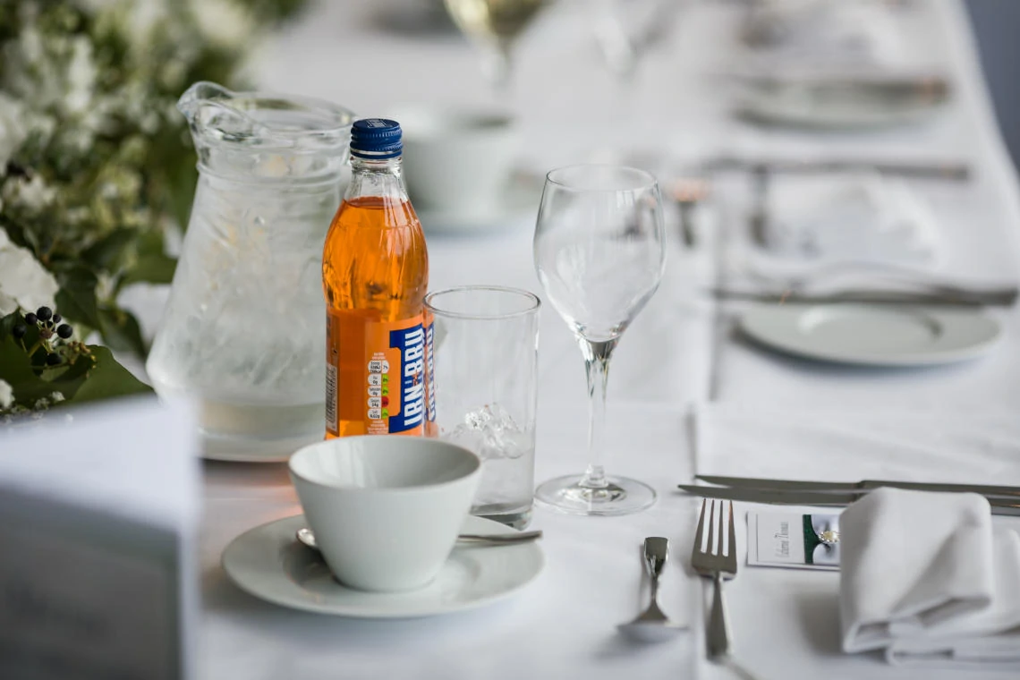 Apex Grassmarket Hotel bottle of irn bru on top table at evening reception