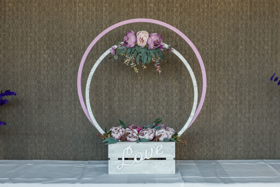 pink and white floral hoops in wooden box with the word love detailing