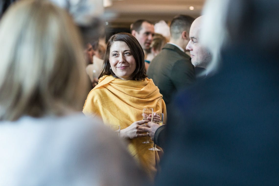 candid photo of lady guest wearing yellow pashmina