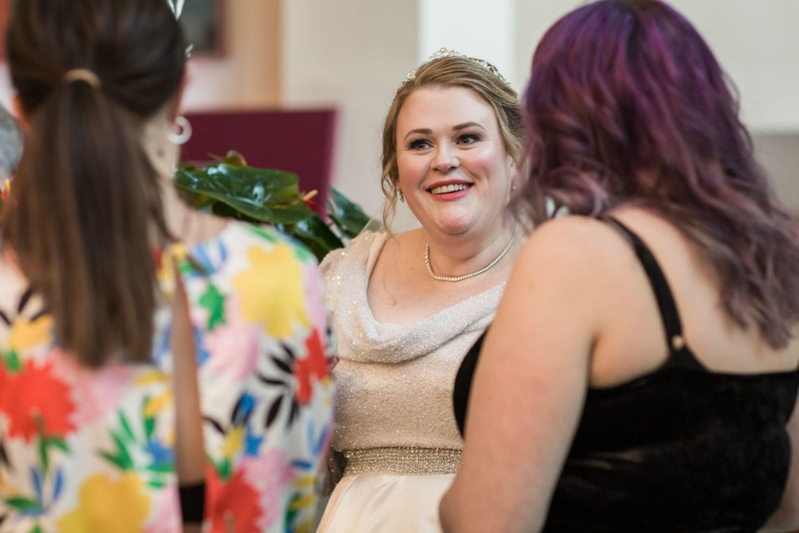 bride smiling as she mingles with guests
