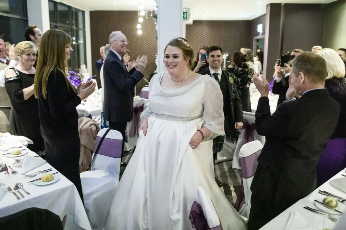 bride and groom enter evening reception