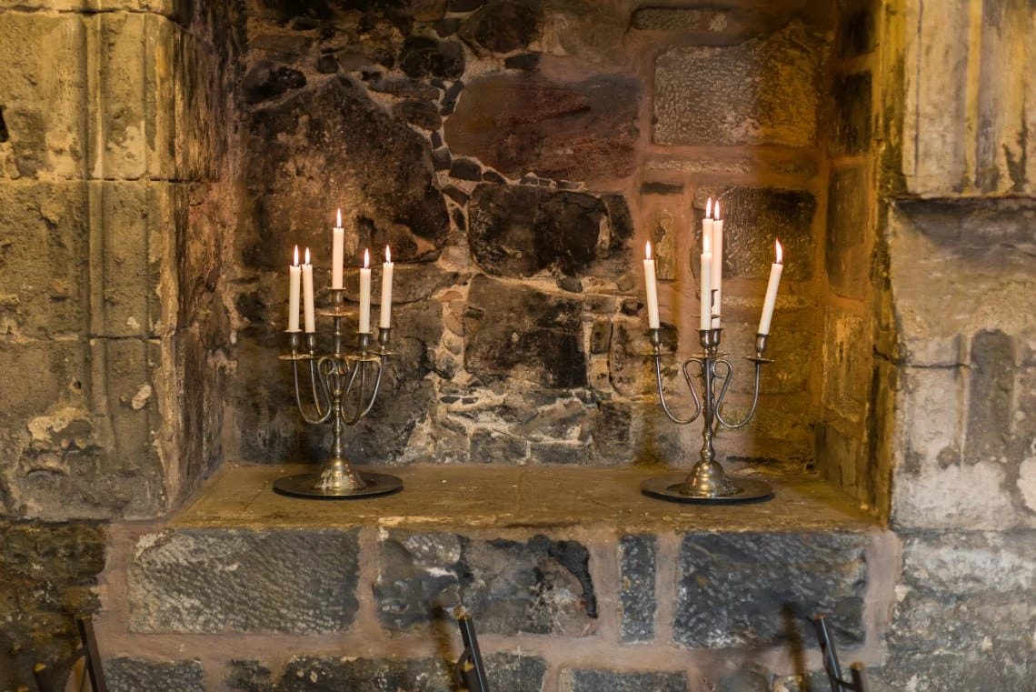 Auld Keep Great Hall candles in an alcove