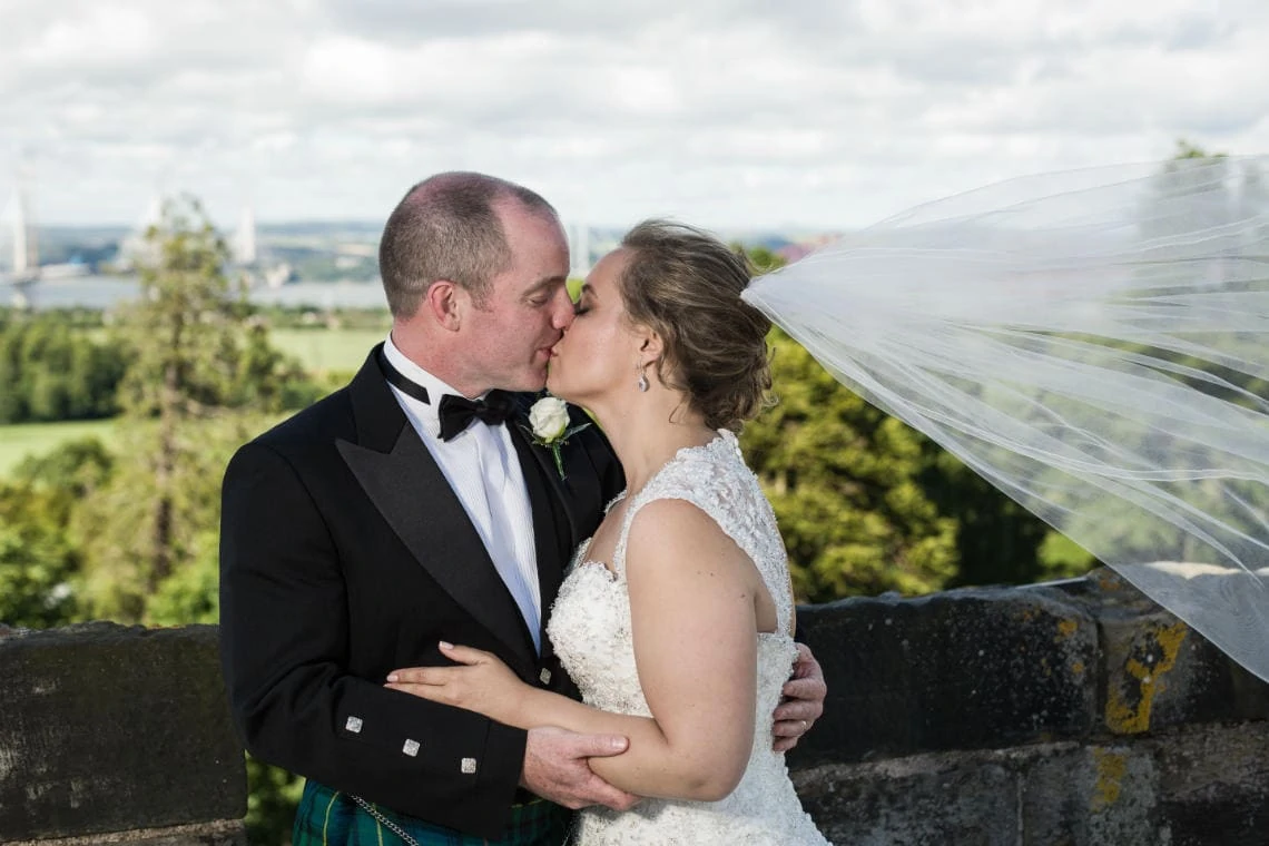 Auld Keep rooftop newlyweds on kissing