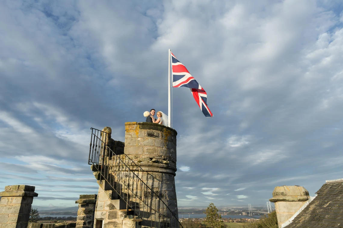 Auld Keep rooftop turret newlyweds embrace - Dundas Castle