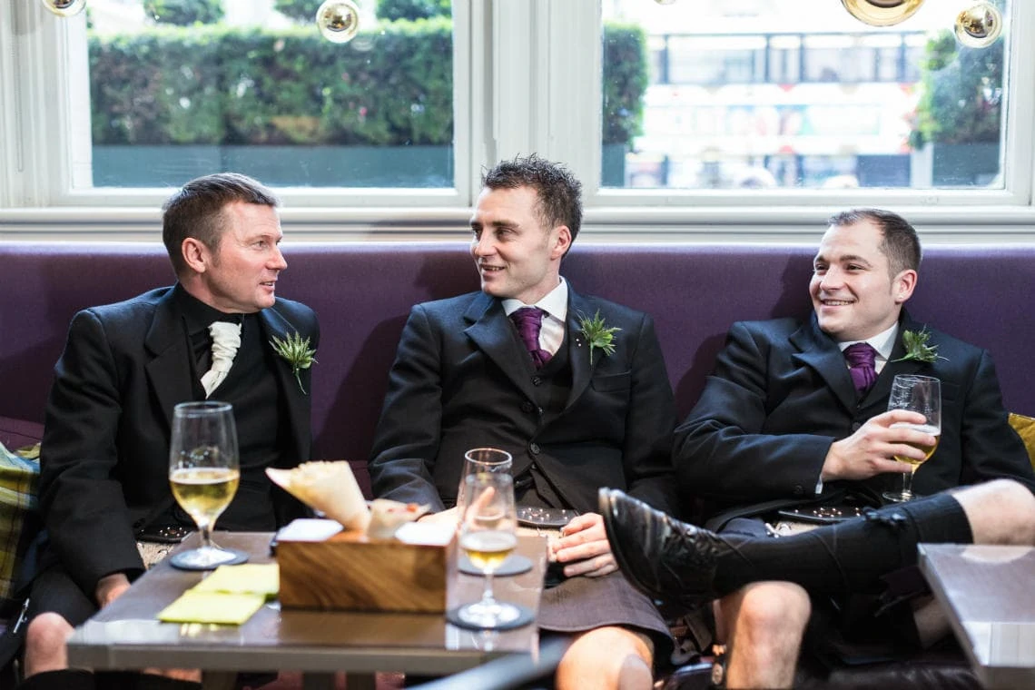 groom and friends enjoying a pre-ceremony beer in the Balmoral Hotel bar