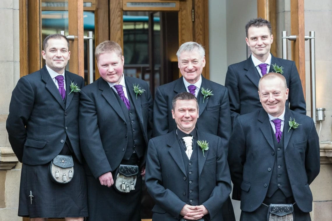 groom and the boys at the entrance to the Balmoral Hotel