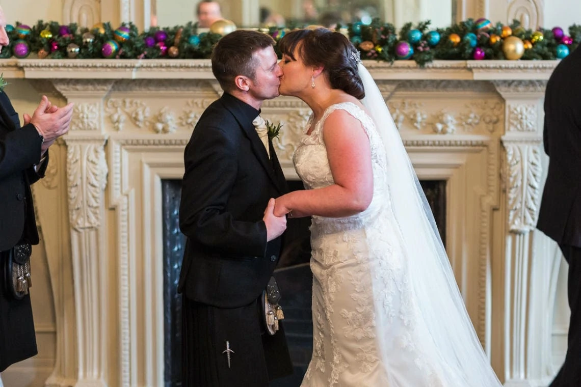 newlyweds' first kiss in the Esk Suite