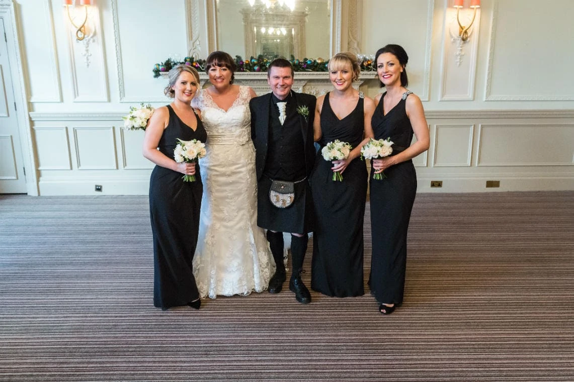 bride, groom and bridesmaids in the Esk Suite