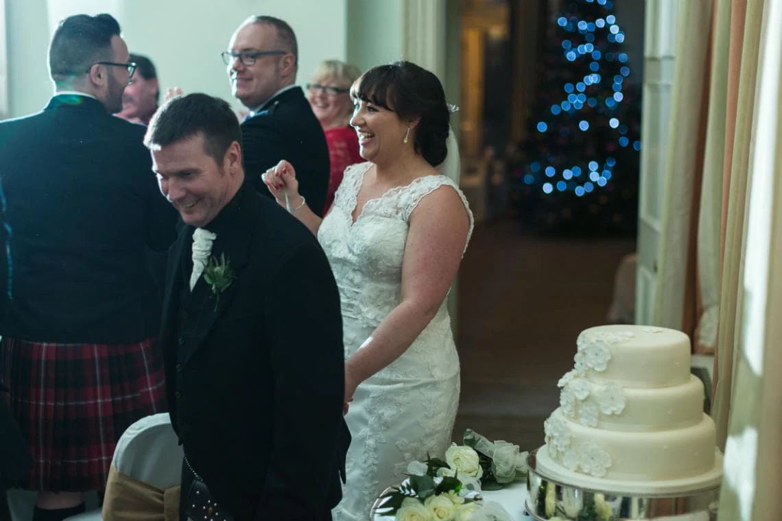bride and groom are cheered into the Beauly Suite