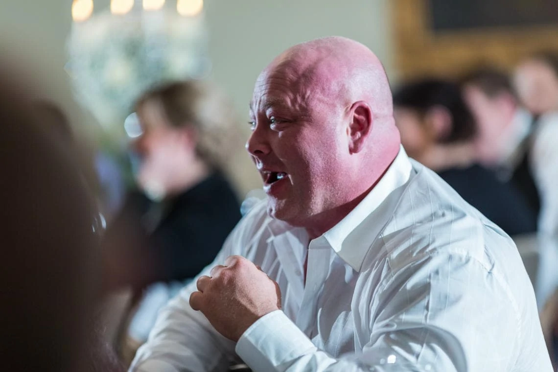guest laughing during the speeches in the Beauly Suite