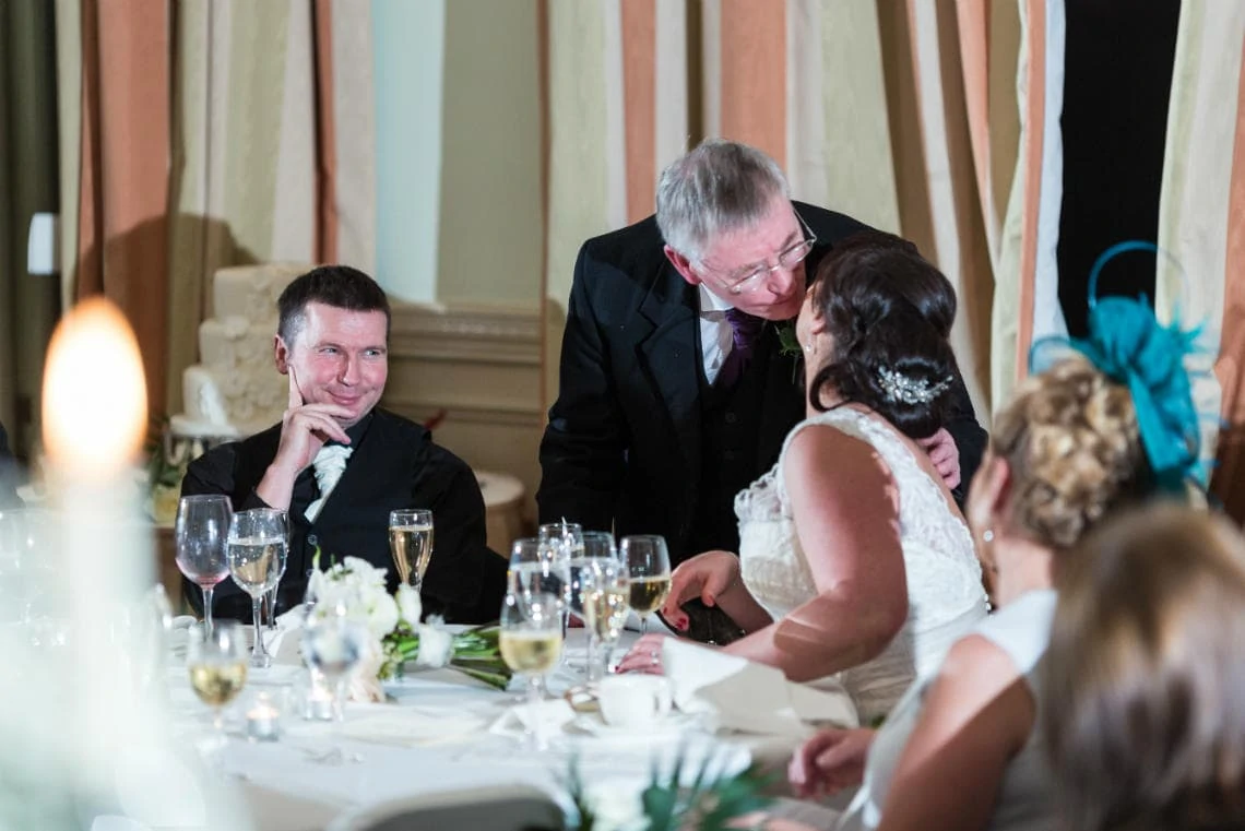 father of the bride kisses his daughter after his speech in the Beauly Suite