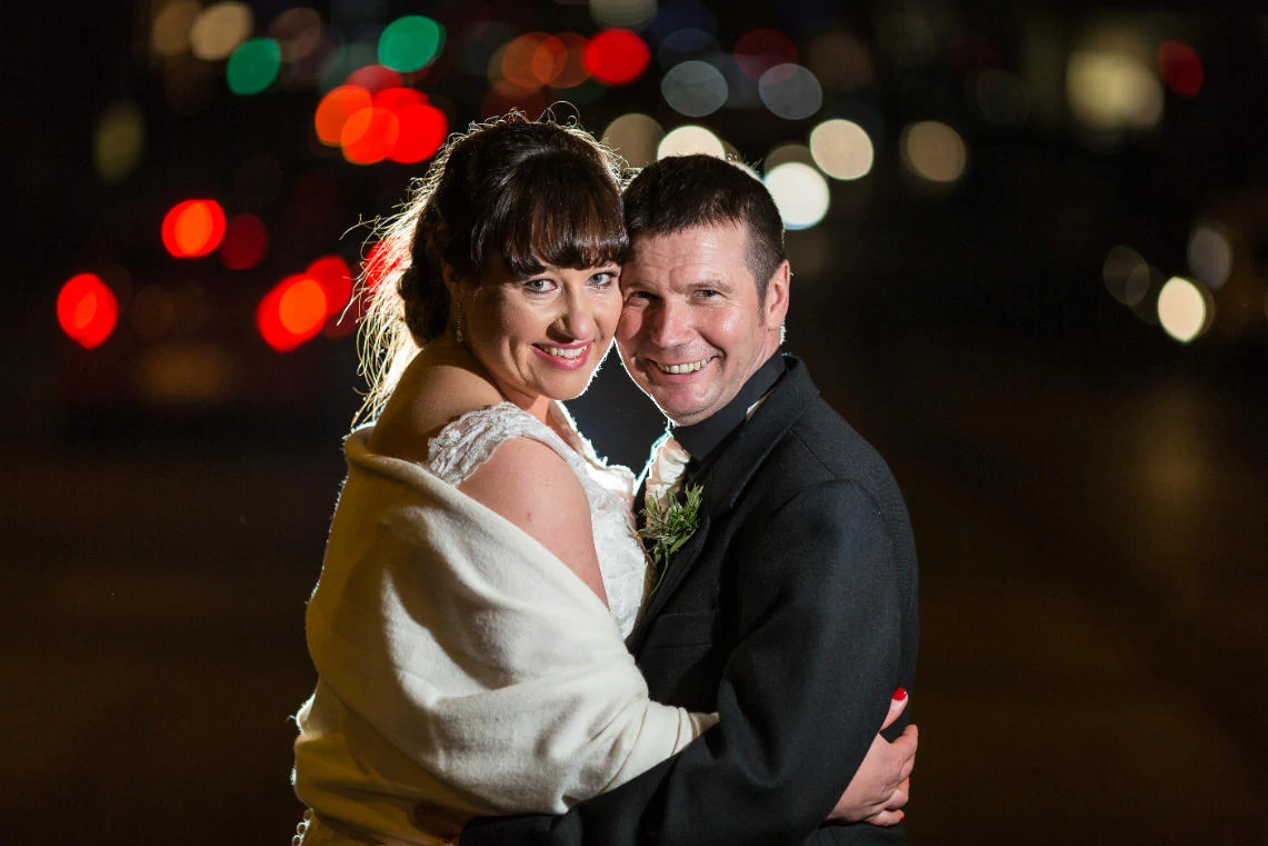 newlyweds backlit photo at night on Waterloo Place