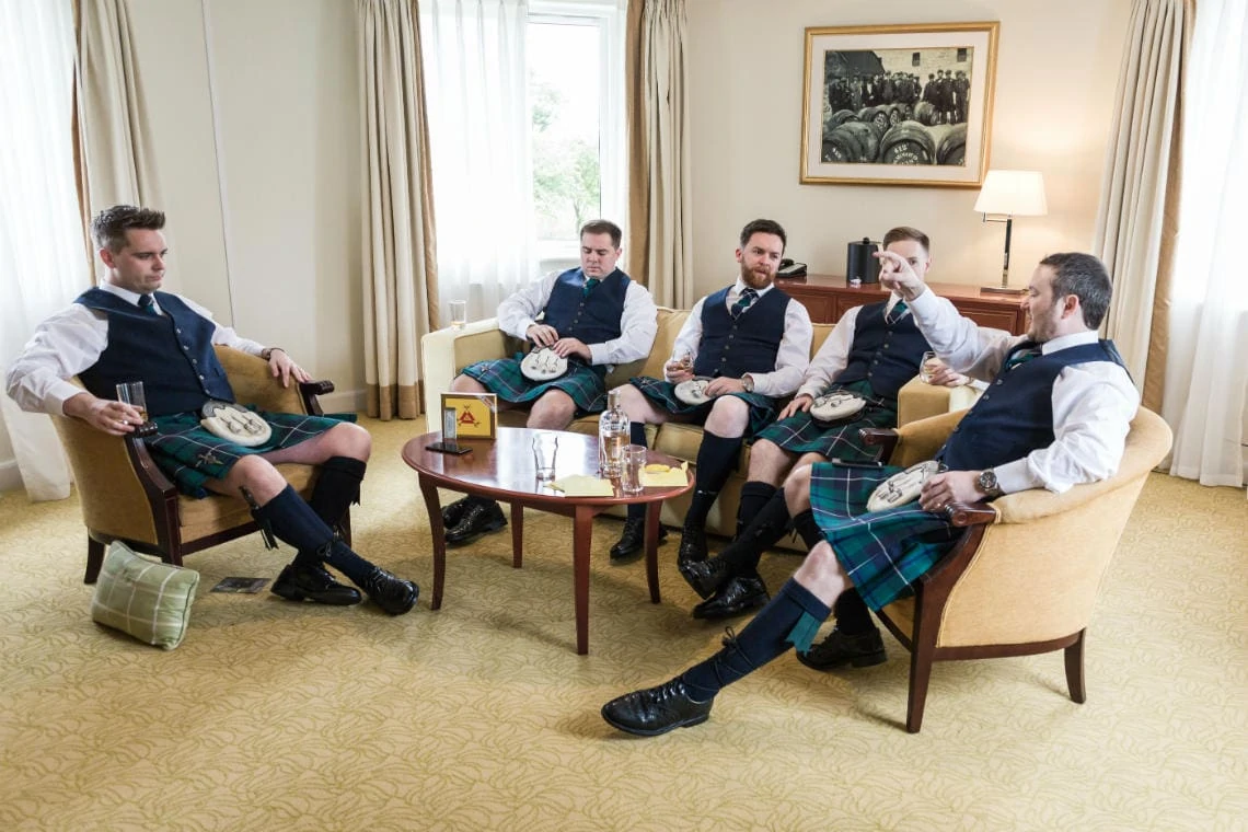 Bedroom - groom and groomsmen enjoying a whisky