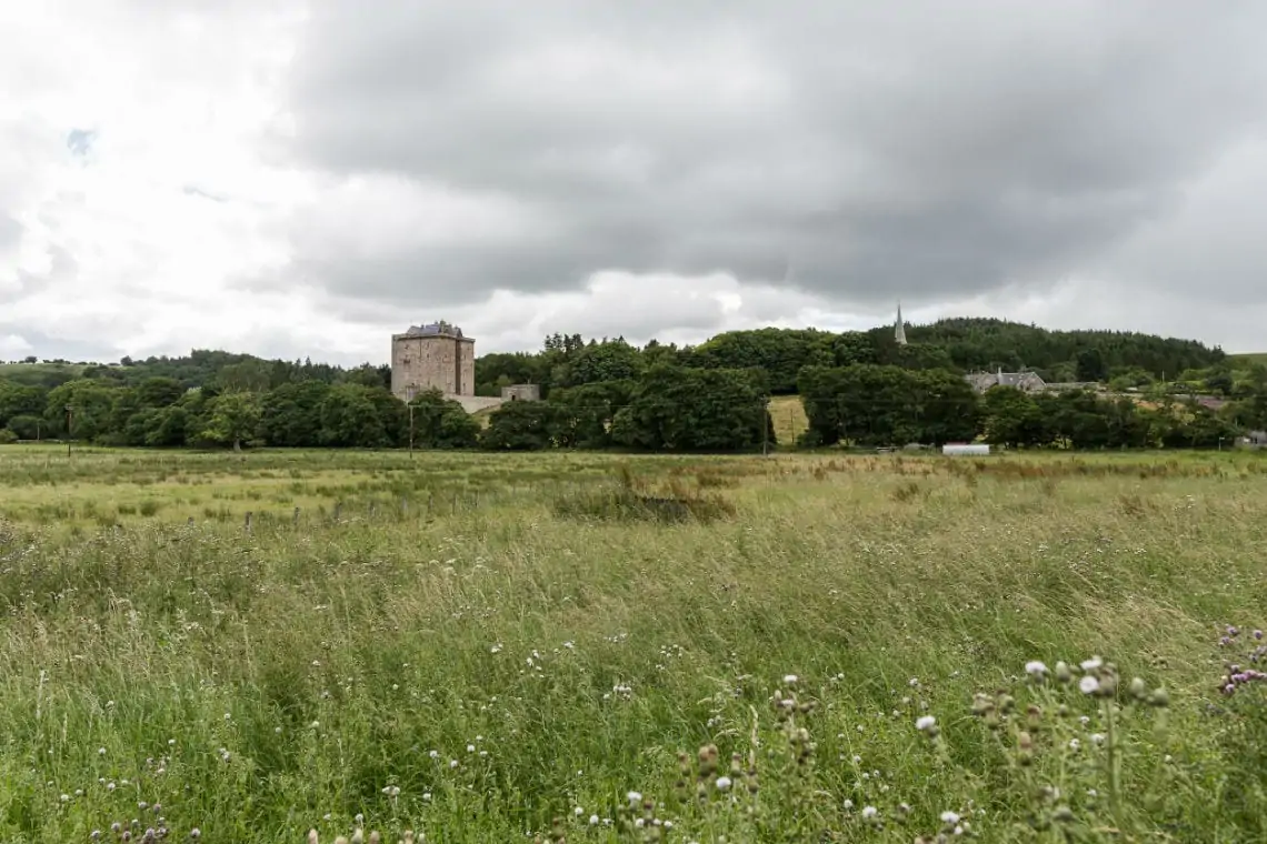 External view of Borthwick Castle from a surrounding field