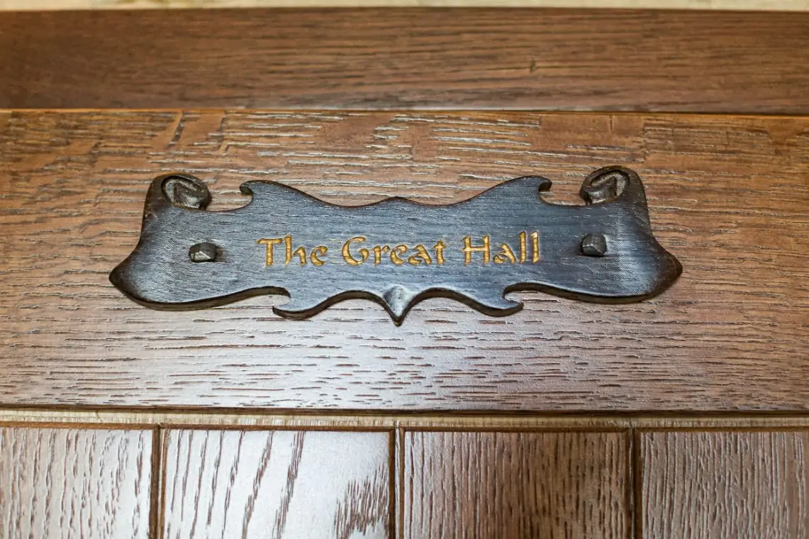 Close up photo of The Great Hall door plaque