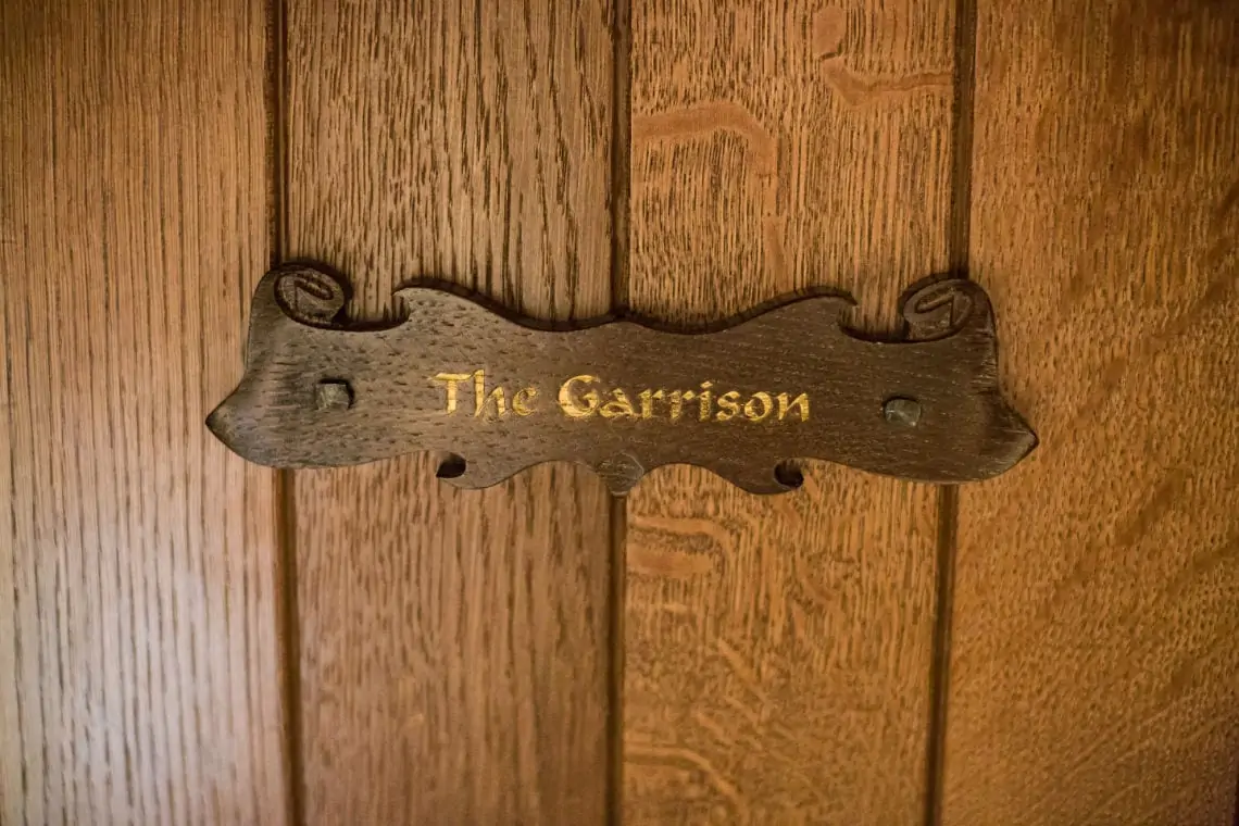 Wooden door with The Garrison name plaque