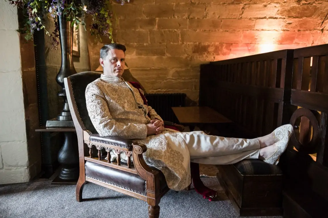 Groom sitting in a chair with his feet up