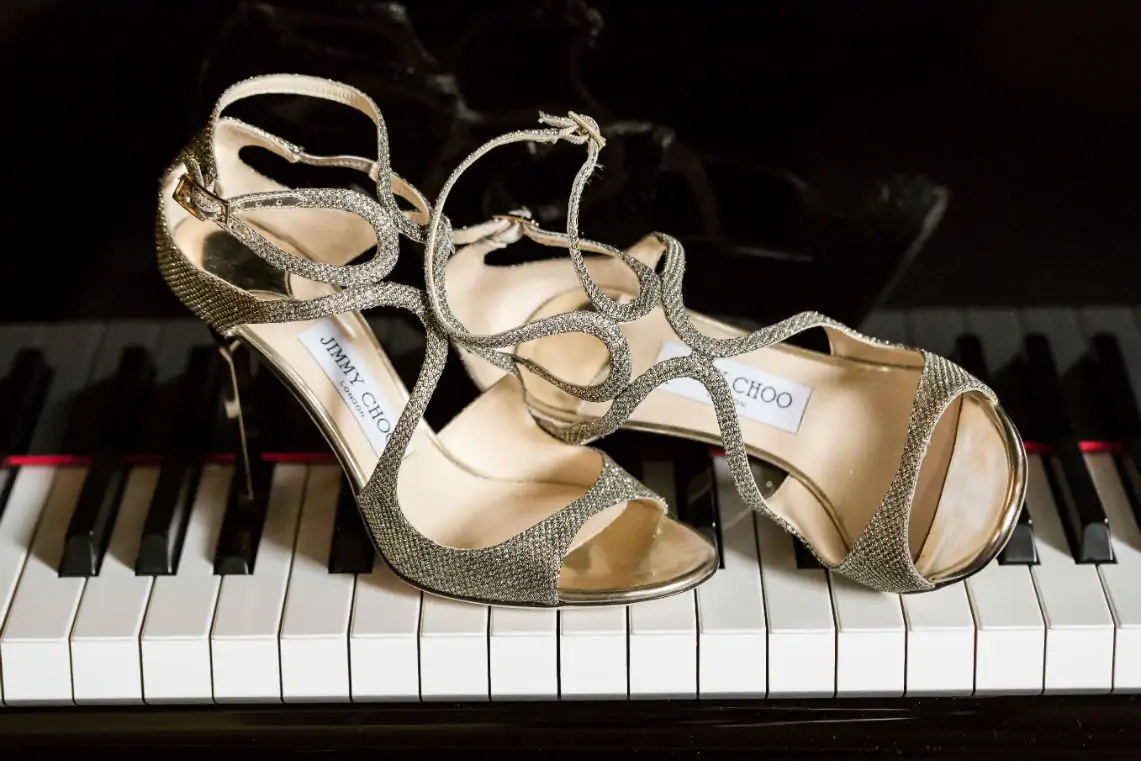 Jimmy Choo high heeled shoes on piano keys