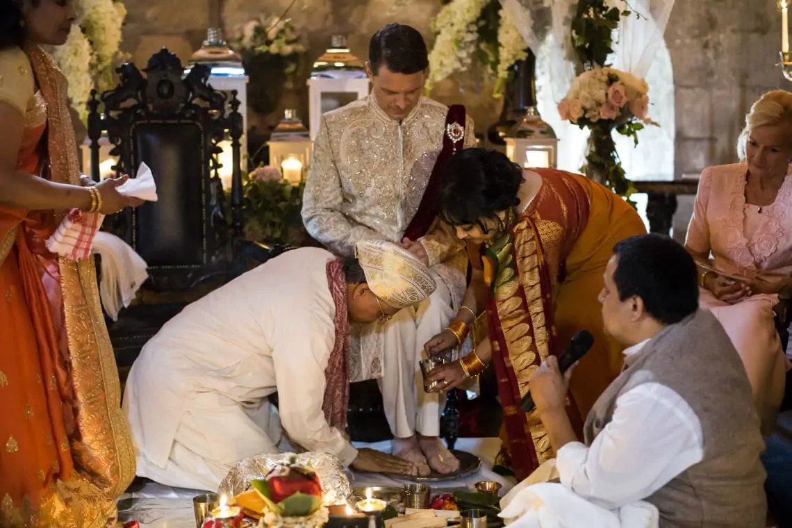 Groom getting his feet blessed