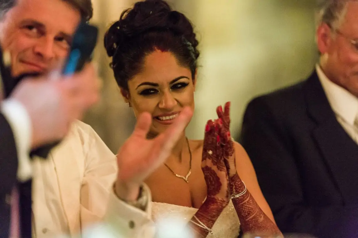 Bride clapping during speeches