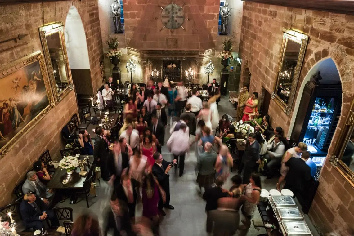 Image taken from above of guests dancing at evening reception