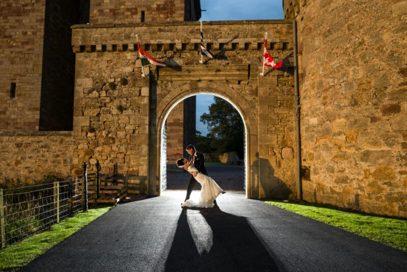 Borthwick Castle wedding - entrance archway newlywed photo