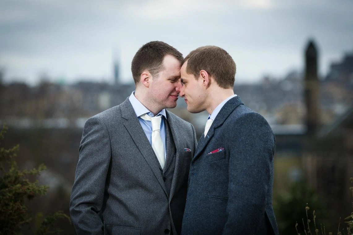 Botanic Gardens same-sex newlyweds with Edinburgh Old Town in the background