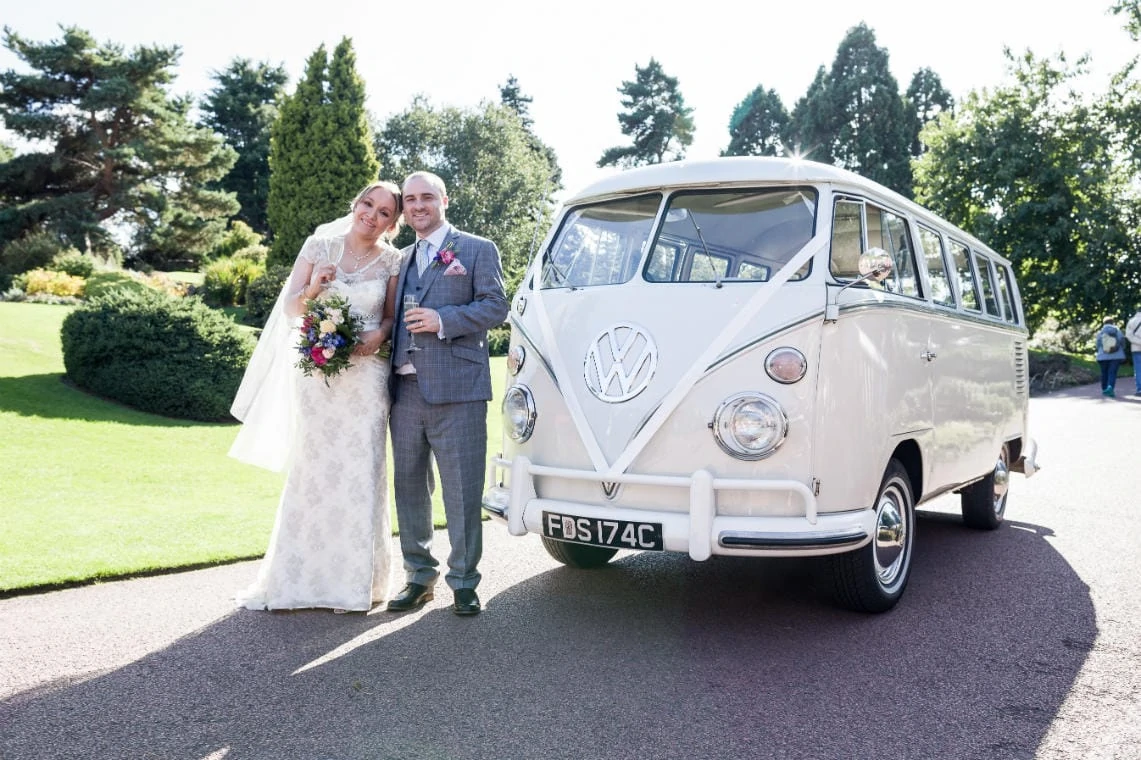 Caledonian Hall newlyweds standing beside a vintage VW transporter