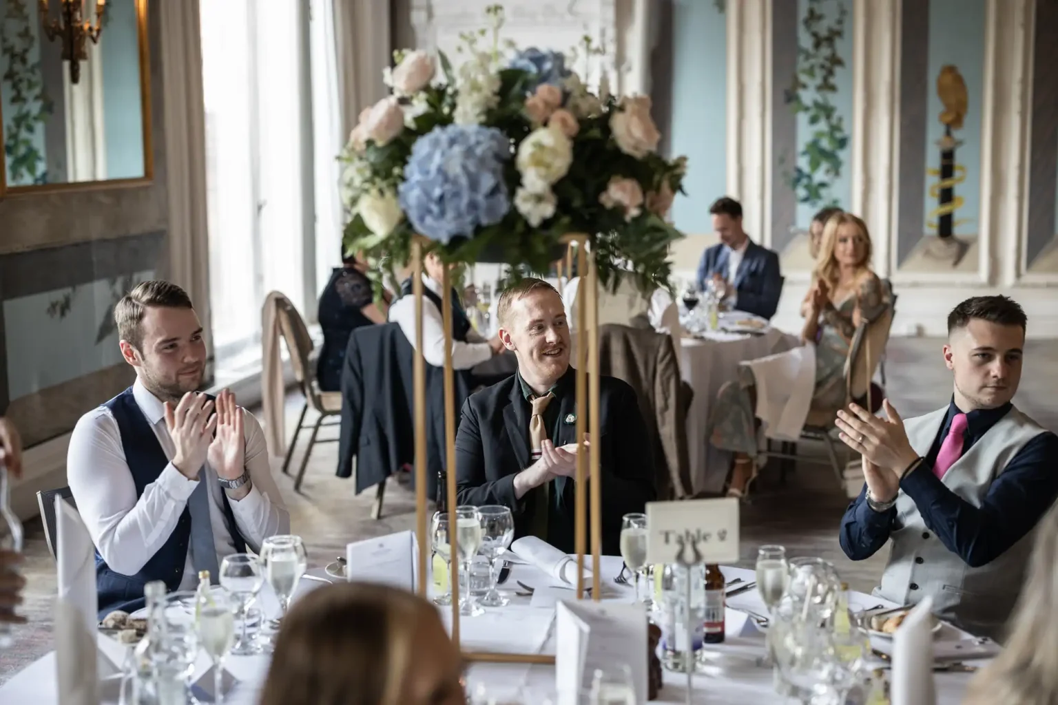 guests applaud the newlyweds' entrance