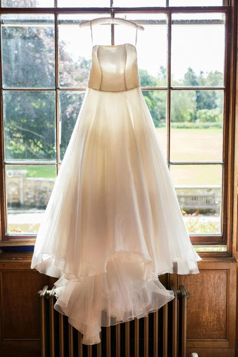 bride's dress hanging up in the window of the library