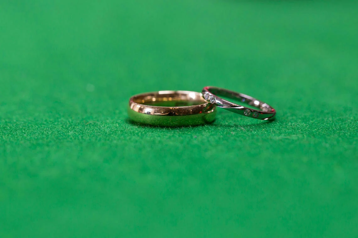 wedding rings on the snooker table