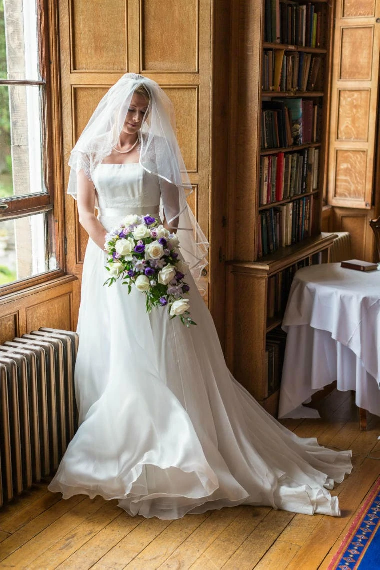 bride full-length by the window in The Library