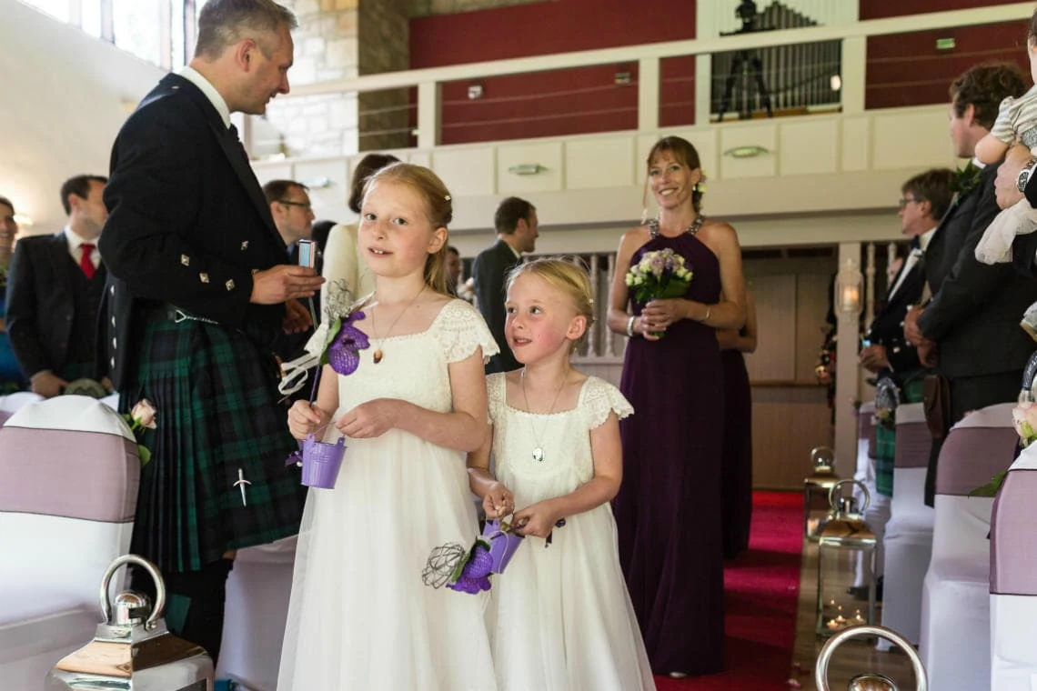 flower girls walking up the aisle in The Chapel