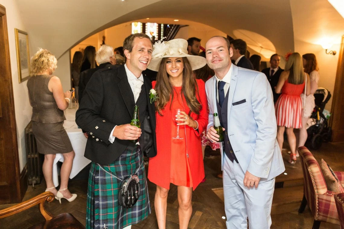 groom and guests during the champagne reception in the Manor House