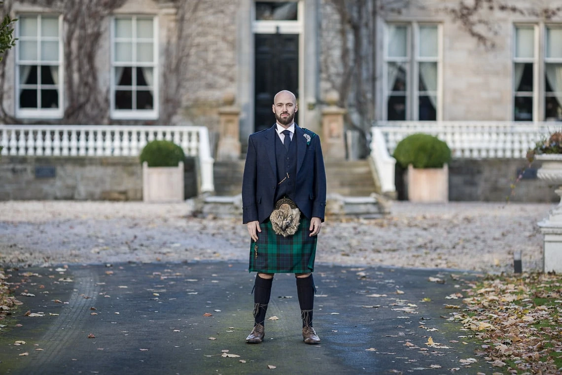 groom standing on the driveway