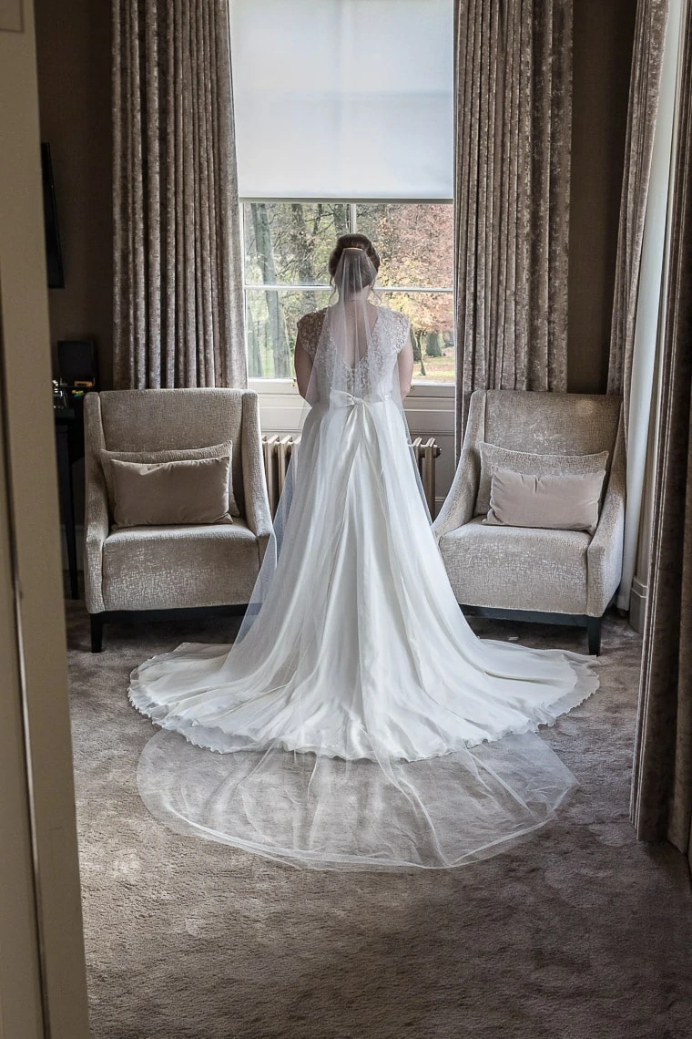 bride view of the back of the dress pre-ceremony photo in bedroom
