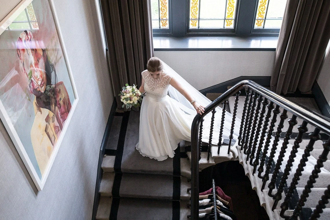 bride making her way down the staircase front view