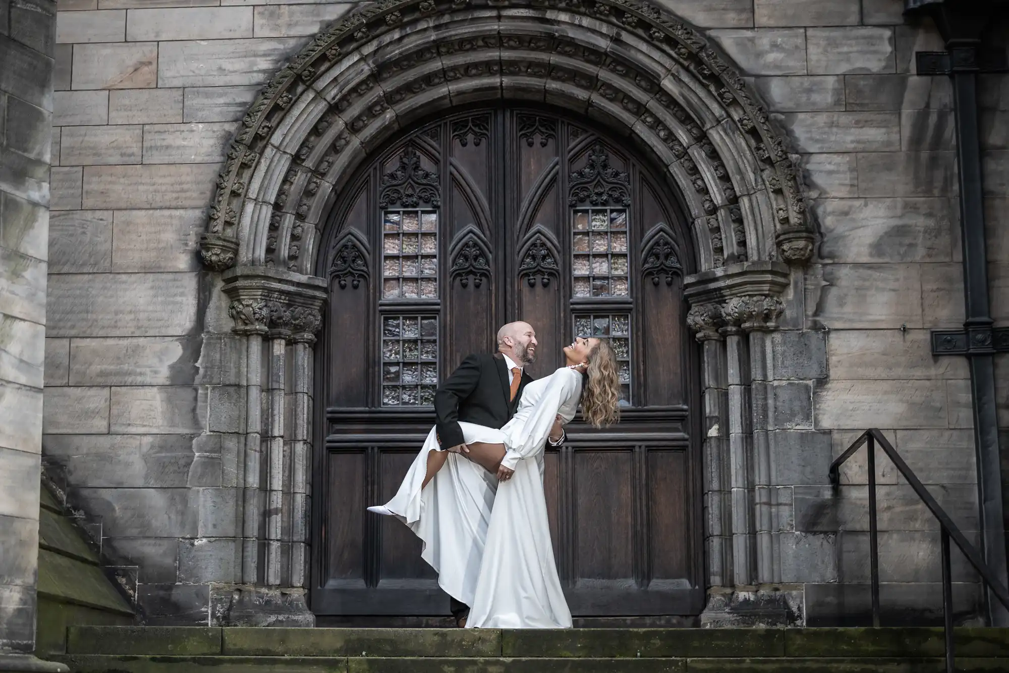 City Chambers newlyweds Sara and Carl on the steps of St Giles Cathedral