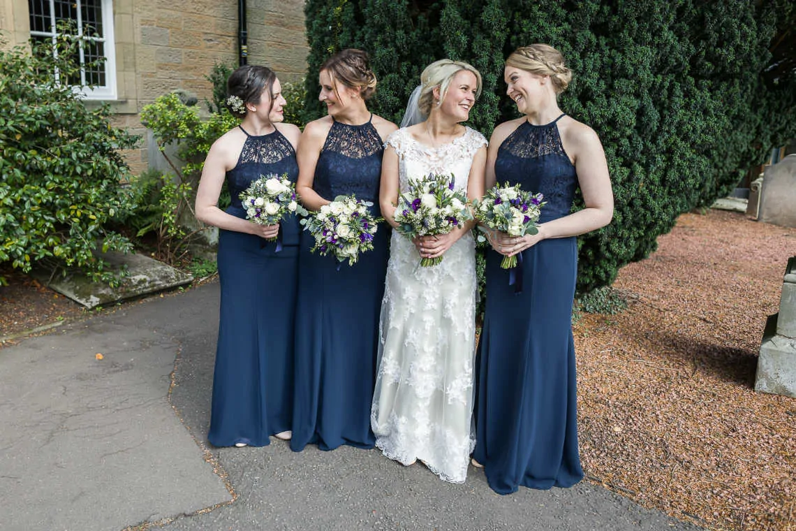 Bride and bridesmaids outside the church