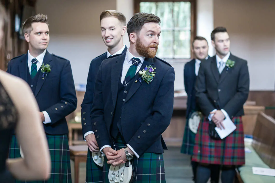 Grooms 'first look' at bride as she walks down the aisle
