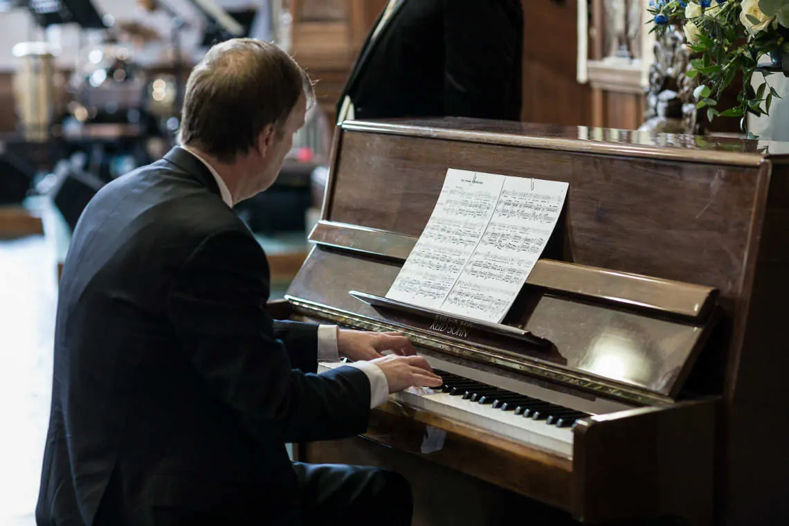 Man playing the piano during church service