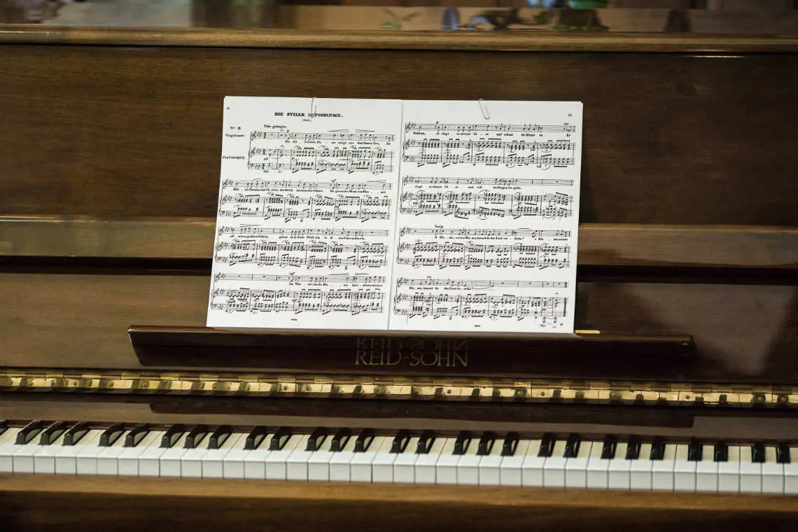 Piano with music sheets in the church