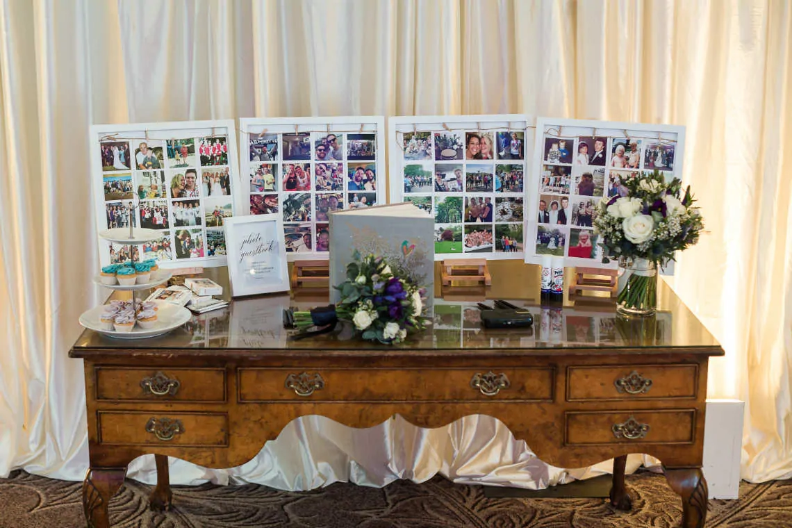 Table with family photo frames and bridal bouquets