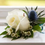 groom's buttonhole white rose and thistle